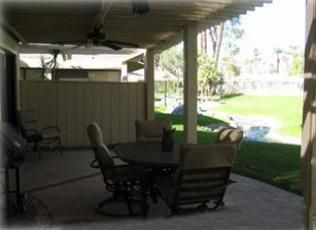Rear patio with pool behind