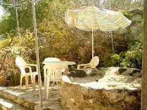 Patio area surounded by flower