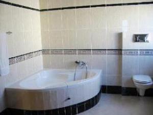 Bathroom with corner bath