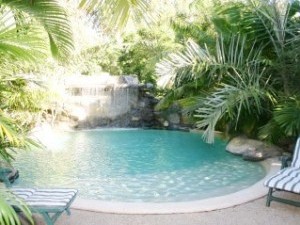 Swimming pool with waterfall