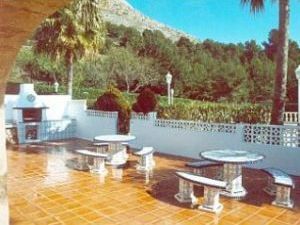 Tiled seating area around BBQ