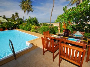 Outdoor dining area near pool