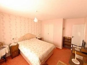 King sized bed in 1st bedroom