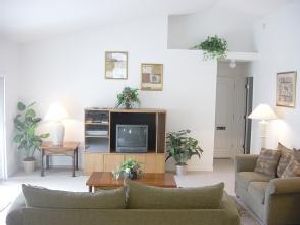 Living room with patio to pool