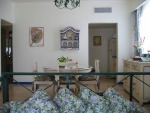 Dining area leading to kitchen