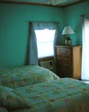 Twin beds & glass doors