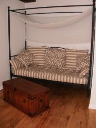 Elegant canopied bed settee