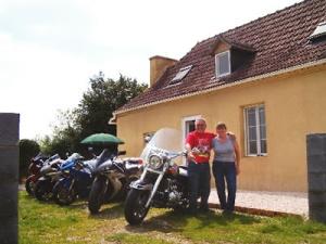 The owners outside the gite