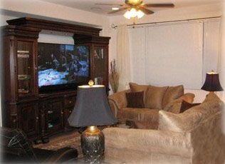 Living room has 62 Inch HD TV 