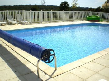 Pool has cover and fence