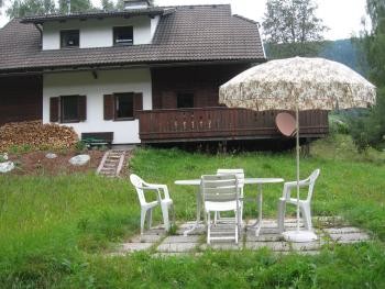 Garden with deckchairs and BBQ