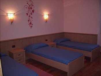 Bedroom with three single beds